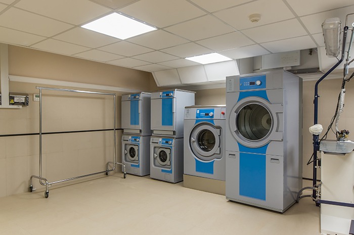 laundry room plain grey and blue washing machines