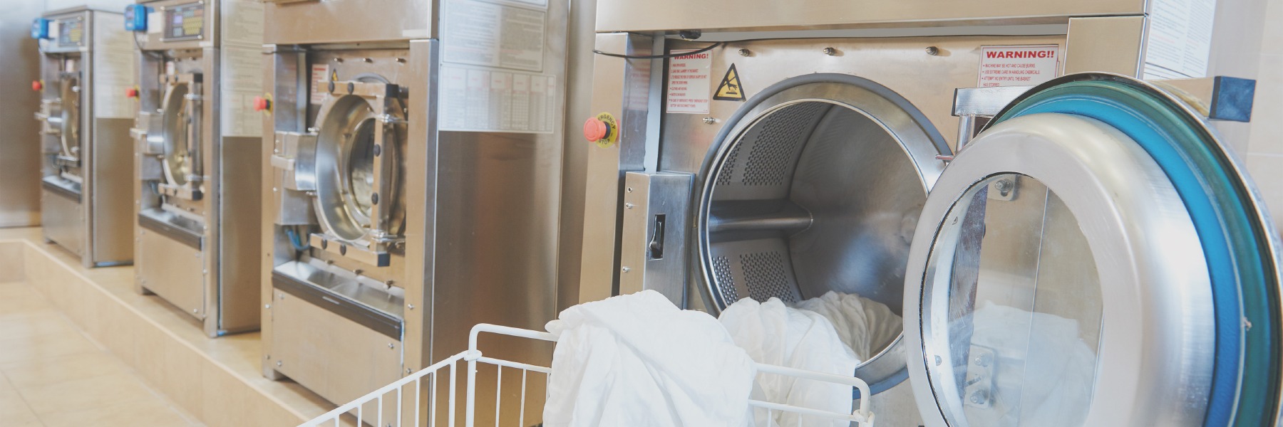 washing machines with white sheets pouring out